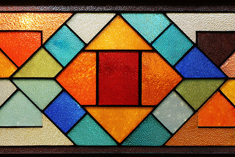 A colorful stained glass window with geometric (6564771)