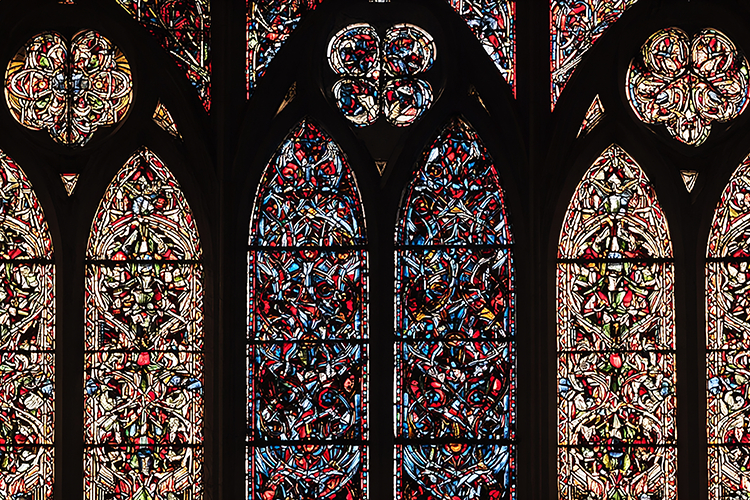 A stunning stained glass window in a historic Gothic church