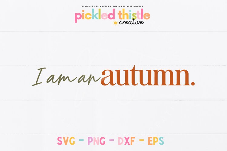 A cozy autumn typography design featuring the words "I am an autumn." with graceful cursive lettering and a contrasting bold serif font.