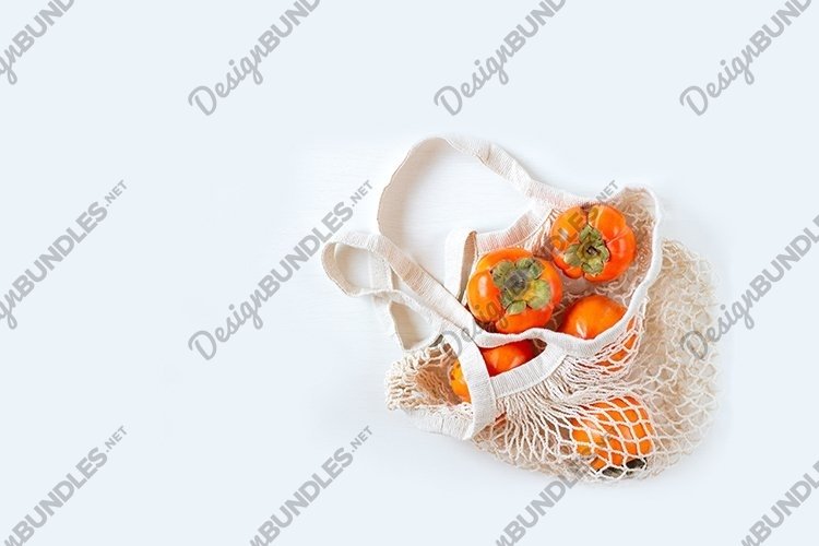 Persimmon in a mesh bag.