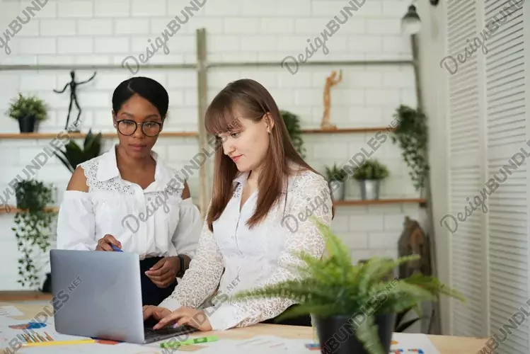 JPG photo- Close up of multiracial colleagues talking