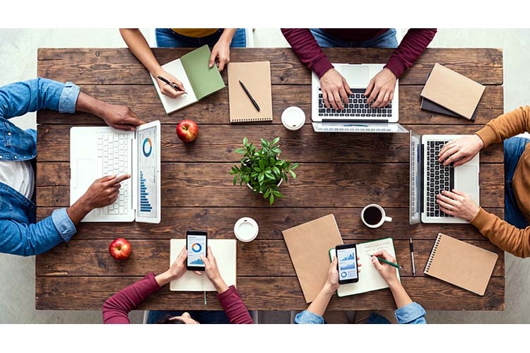 Top View of Creative Team Brainstorming in Office Workspace