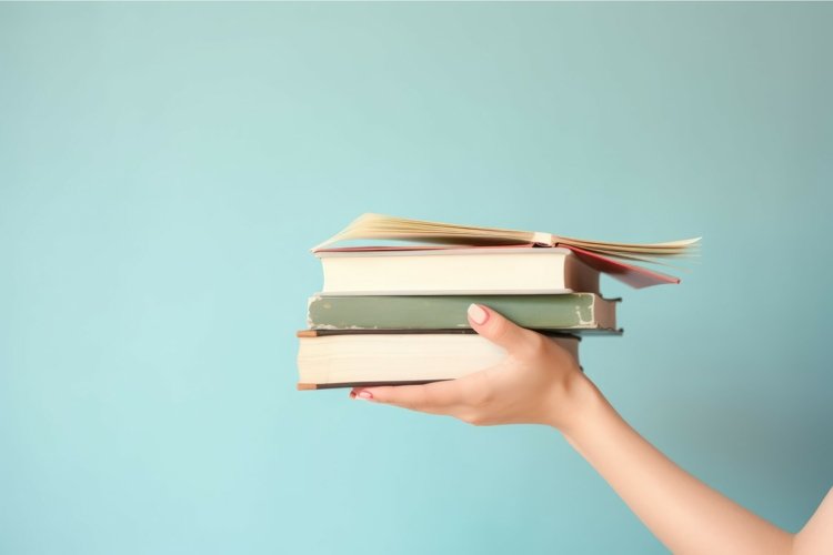 Hand holding stack of books. Generate ai