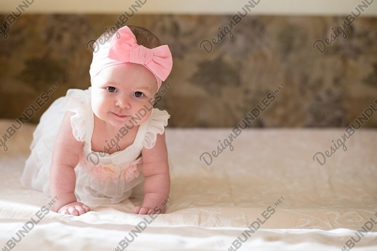 Portrait of pretty baby girl on bed , Family, childhood