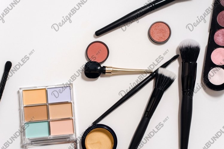 Makeup products on white background with copy space example image 1