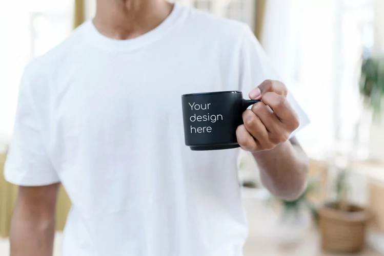 Mockup on a black mug in the hands of a black man at home.