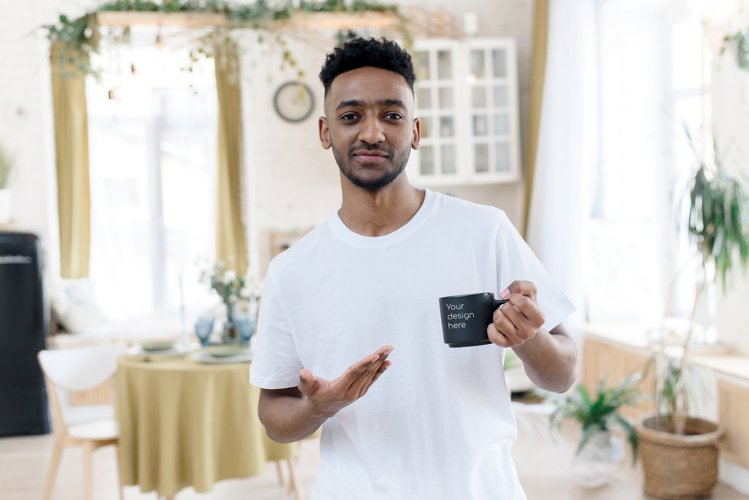 Arab man pointing at black mug with mockup in home interior example image 1