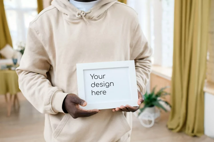 Horizontal white frame in the hands of a black man