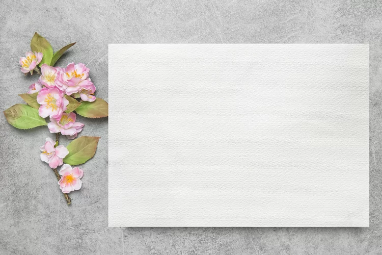 Watercolor paper mockup with spring flowers stock photo