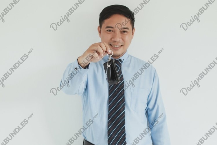 Salesman giving a key example image 1