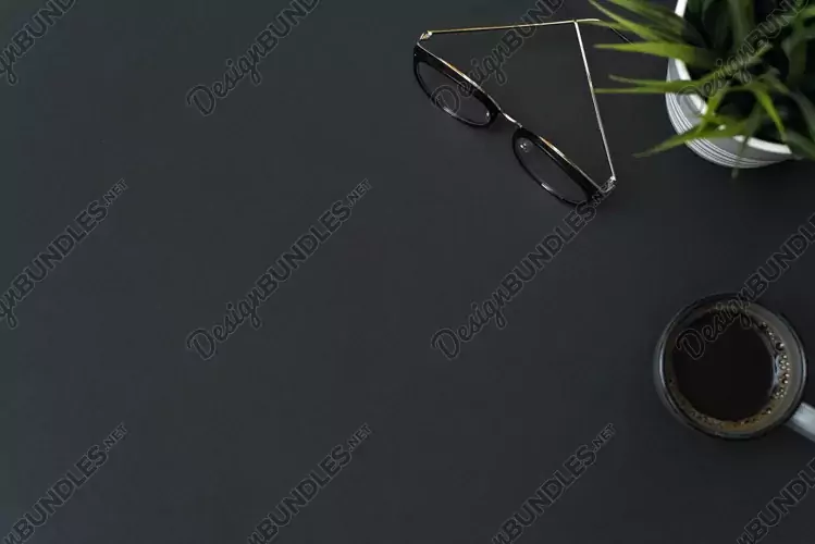 Glasses, coffee on a black background with copy space