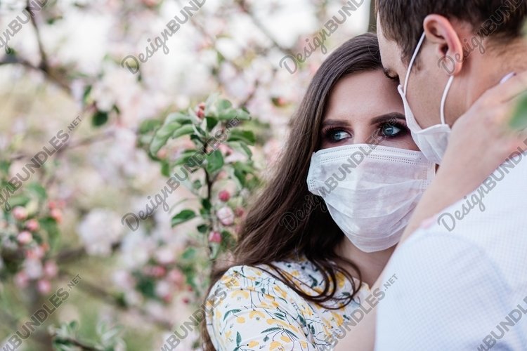 lovely young couple wearing masks during a pondemic, virus example image 1