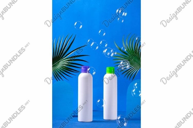 Mockup with beauty product in white bottles and bubbles
