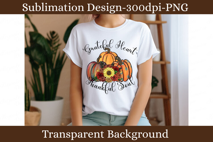 Colorful fall pumpkin arrangement with sunflower, red roses, autumn mums and green leaves featuring the phrase Grateful Heart Thankful Soul.