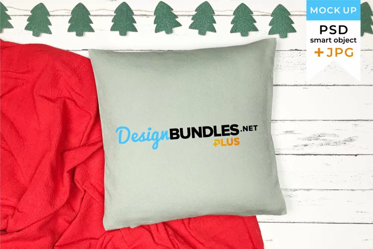Green Christmas pillow mockup with red blanket and garland