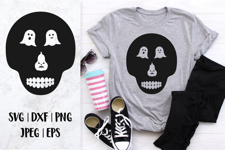 Skull silhouette with ghost cutout eyes and pumpkin nose SVG example image 1
