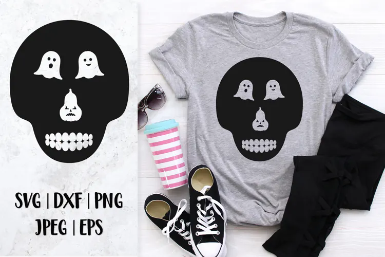 Skull silhouette with ghost cutout eyes and pumpkin nose SVG
