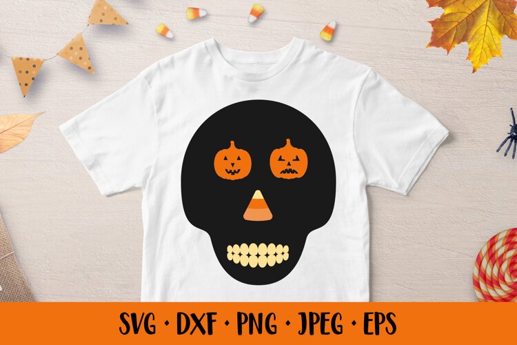 Skull silhouette with pumpkin cutout eyes and candy nose SVG example image 1