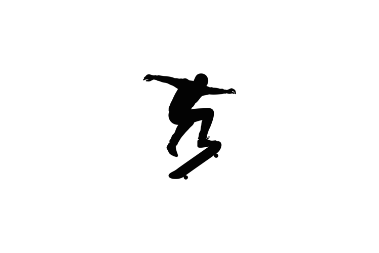 Dynamic skateboarder performing a trick in mid-air with a mi