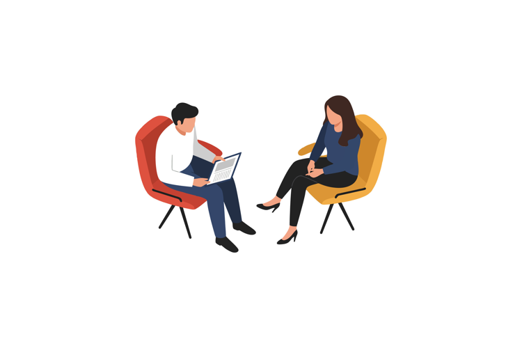 Two people engaged in conversation while sitting in colorful