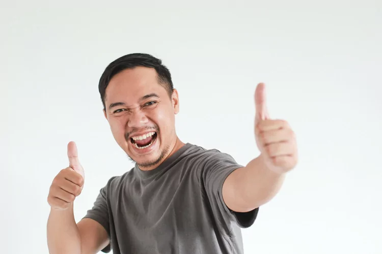 Asian Man Showing Thumbs Up