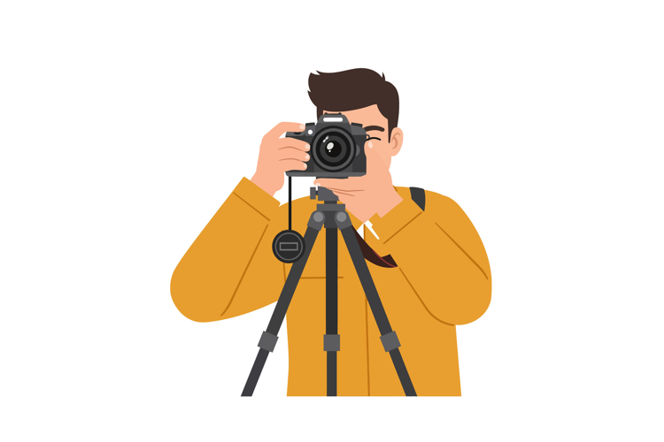 Photographer capturing image with camera on tripod in yellow