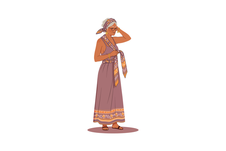 Woman wearing headscarf and long patterned dress standing in