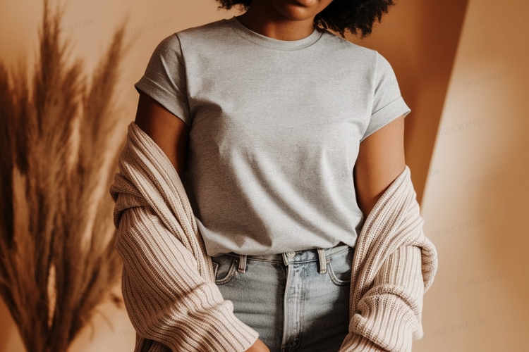 Woman wearing grey t shirt and beige cardigan image
