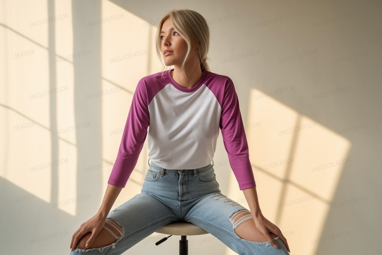Woman wearing raglan shirt and ripped jeans example image 1