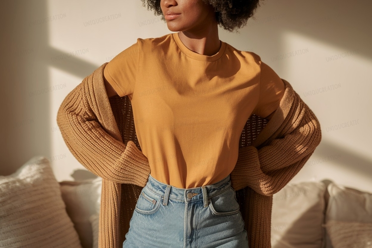 Woman wearing orange shirt and blue jeans image