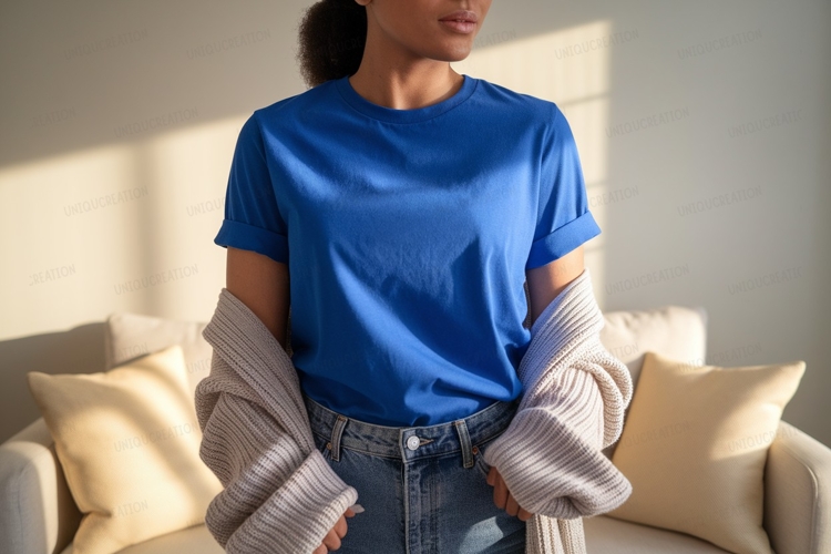 Woman wearing maroon t shirt and denim image