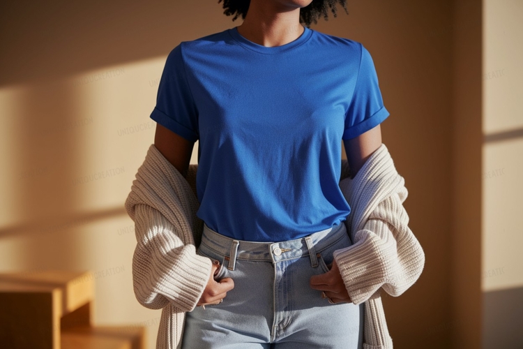 Blue shirt light jeans cream cardigan image
