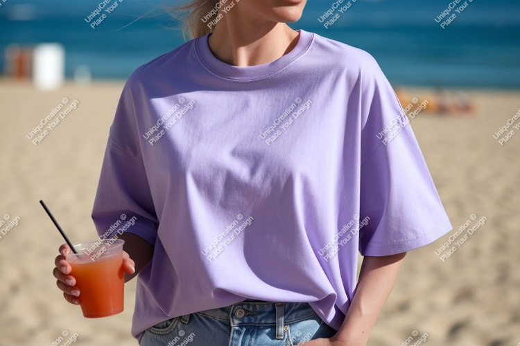 Purple t shirt with drink on beach image
