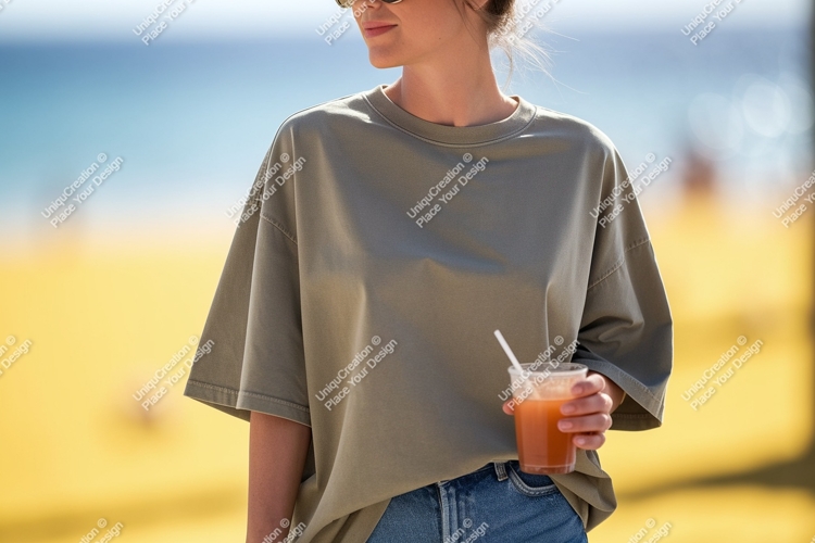 Woman wearing olive green t shirt holding drink image