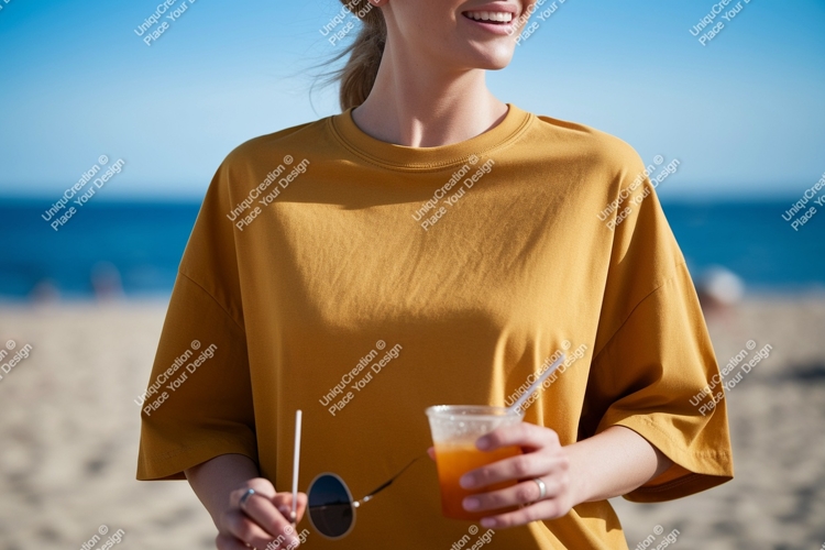 Woman holding drink and sunglasses on beach ocean sand