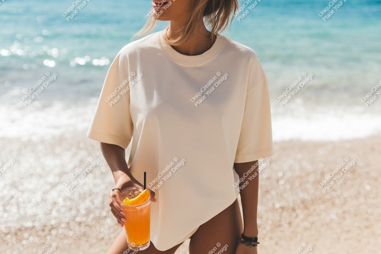 Woman holding orange drink on beach ocean