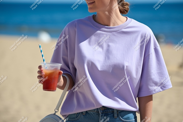 Woman wearing lavender t shirt holding drink image
