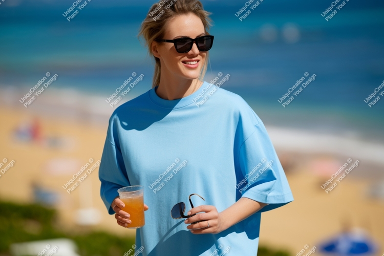 Woman holding drink sunglasses beach ocean