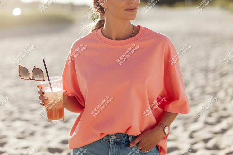 Coral sweatshirt denim jeans beach drink image