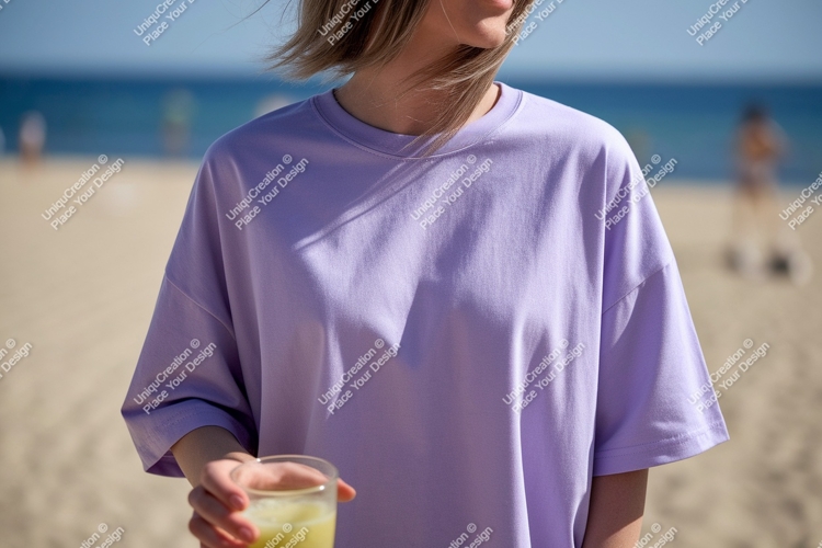 Woman wearing lavender t shirt holding drink image