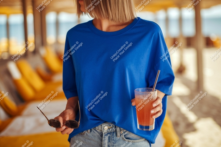 Blue shirt woman holding sunglasses drink image