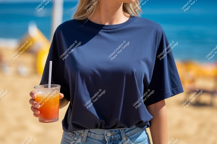 Woman wearing navy t shirt holding orange drink image