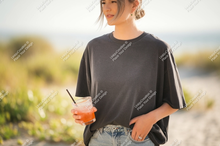 Woman holding drink at beach summer casual