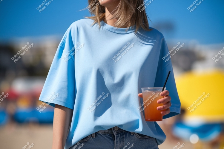 Light blue t shirt holding drink straw