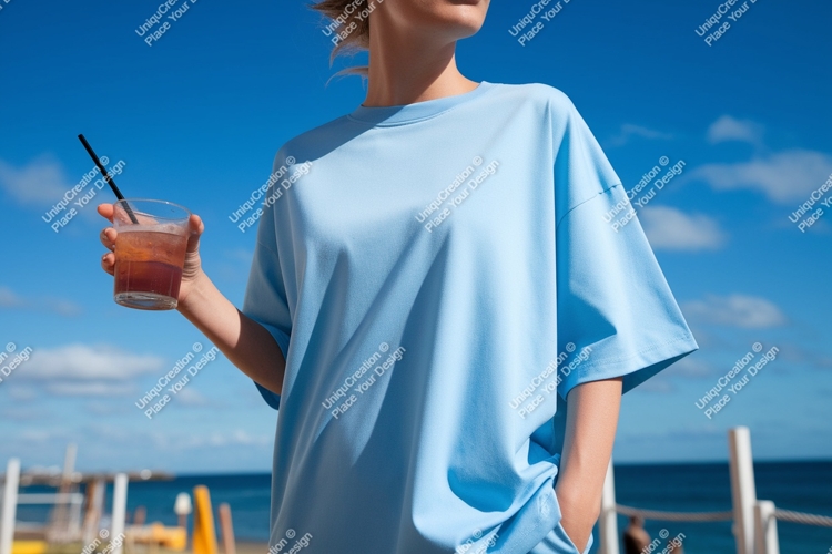 Light blue t shirt woman holding drink image