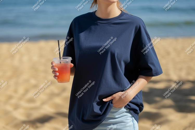 Woman holding drink on beach navy t-shirt