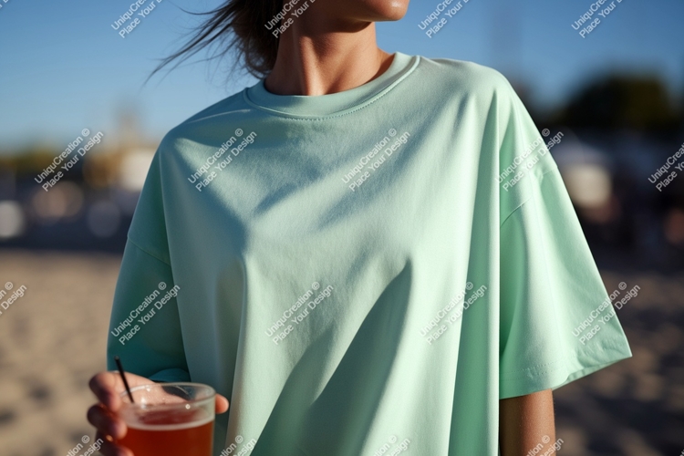 Mint green t shirt with drink image