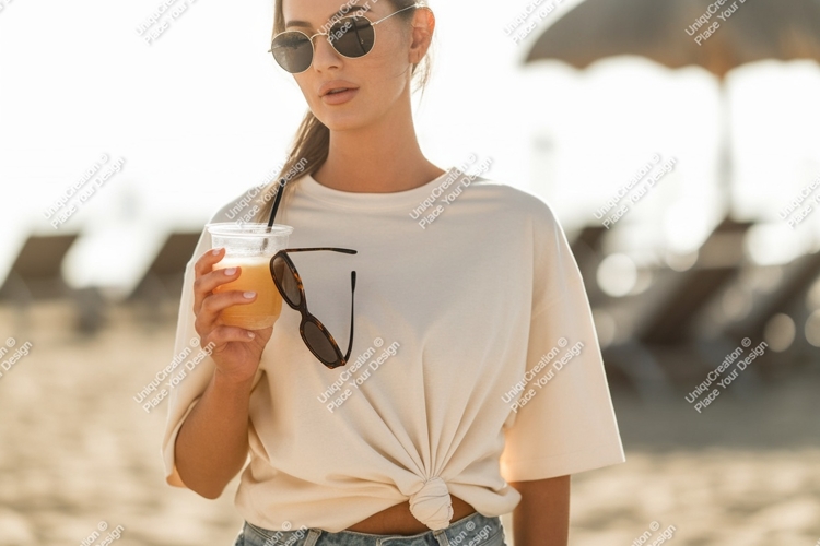 Woman holding drink and sunglasses beach summer
