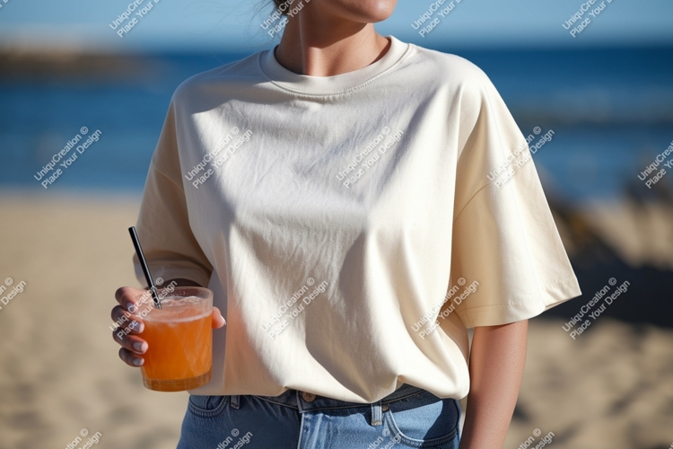 Cream shirt woman holding orange drink image