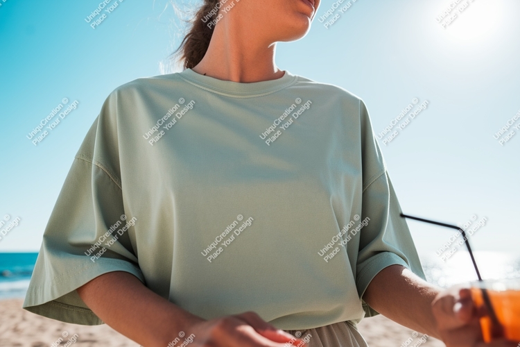 Woman wearing light green t shirt on beach ocean